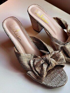 Gold metallic Lulu’s bow mules